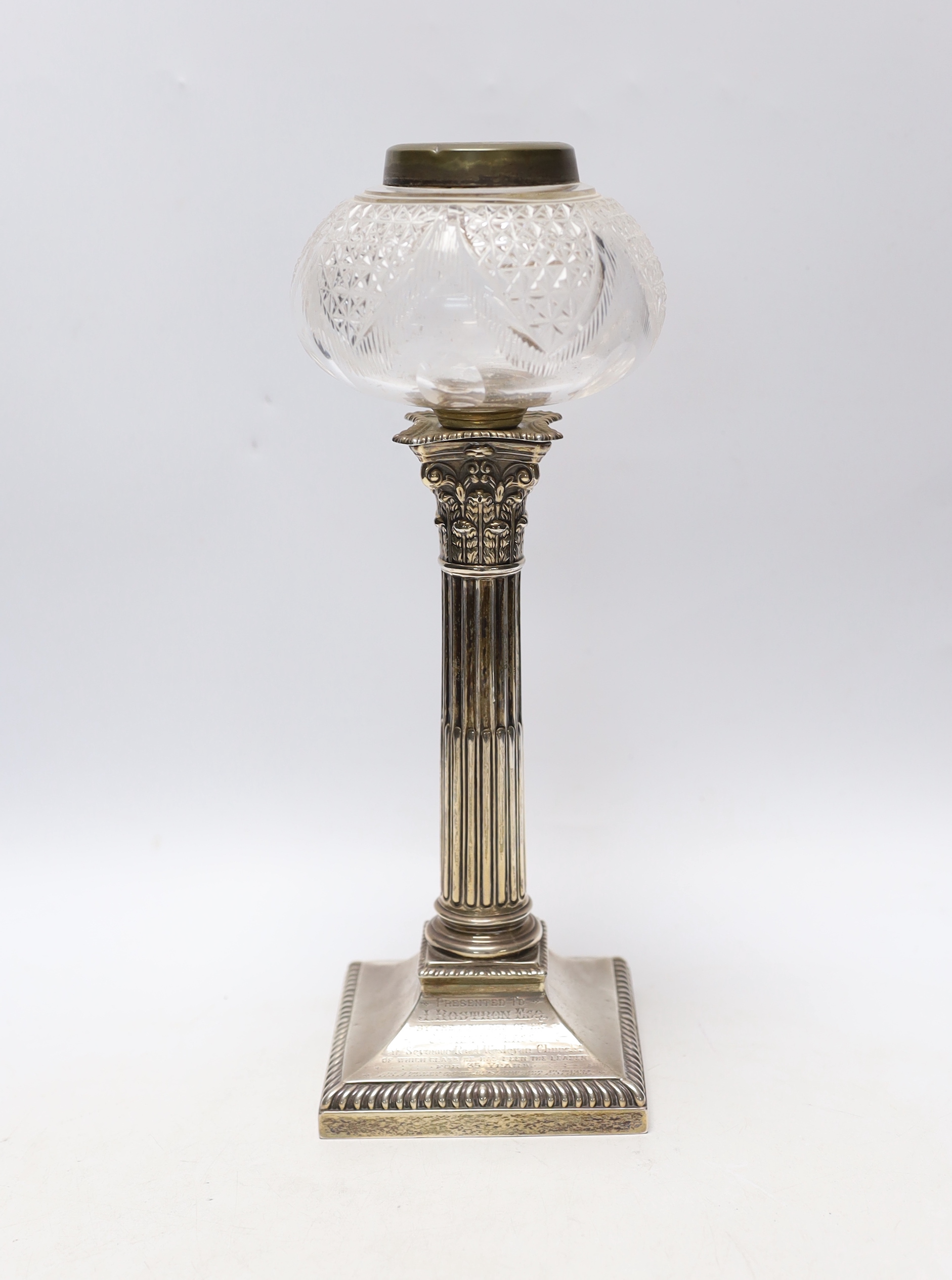 An Edwardian silver mounted Corinthian column candlestick, Thomas Bradbury & Son, London, 1901, 23cm, now with a silver plate mounted glass reservoir.